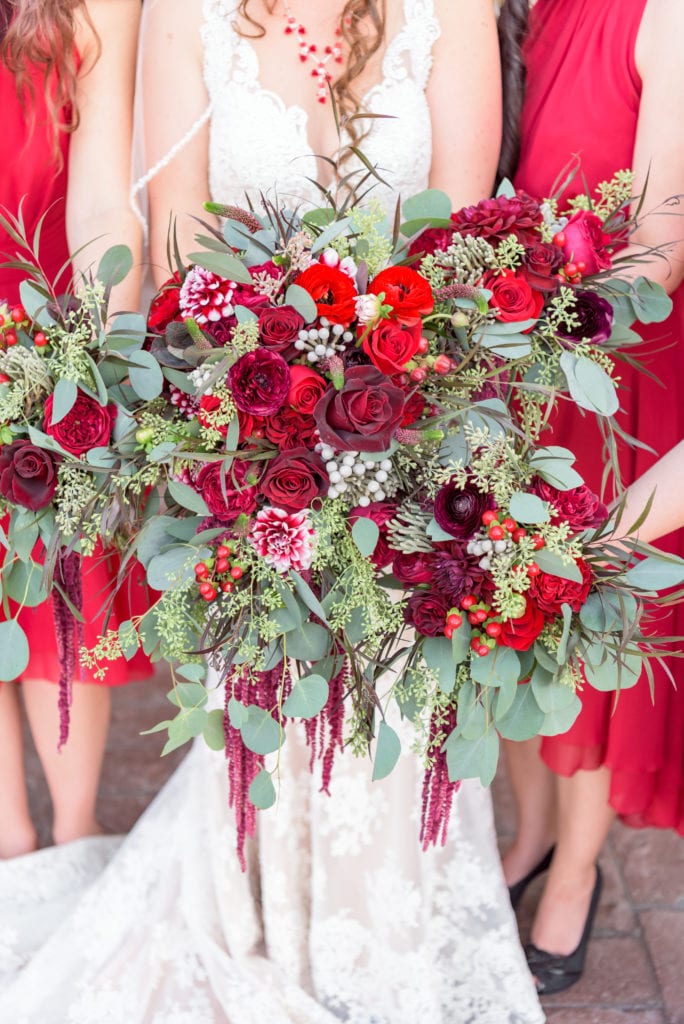 How to spend your wedding budget- a photo of beautiful bouquets with red flowers.