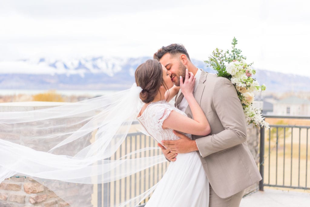 A beautiful couple about to kiss at the Sleepy Ridge in Orem.