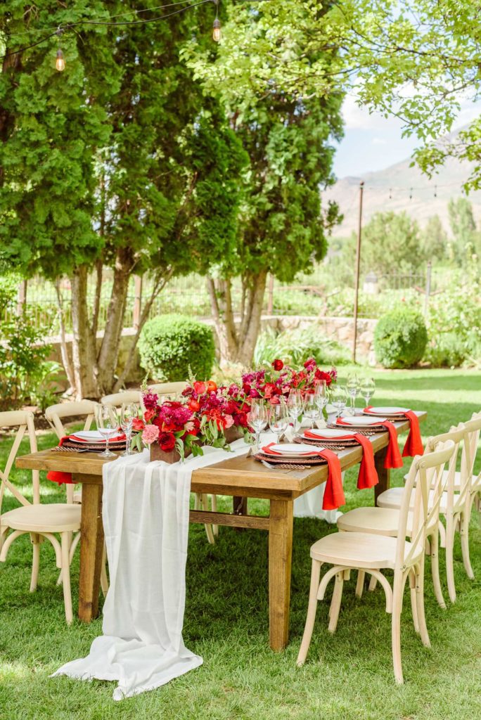 A wedding reception timeline typically includes a dinner service with beautifully decorated tables like this one.