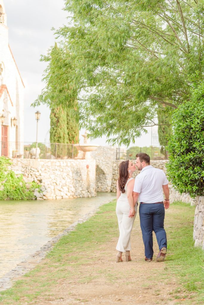 A European style engagement session with a cute couple dressed in white.
