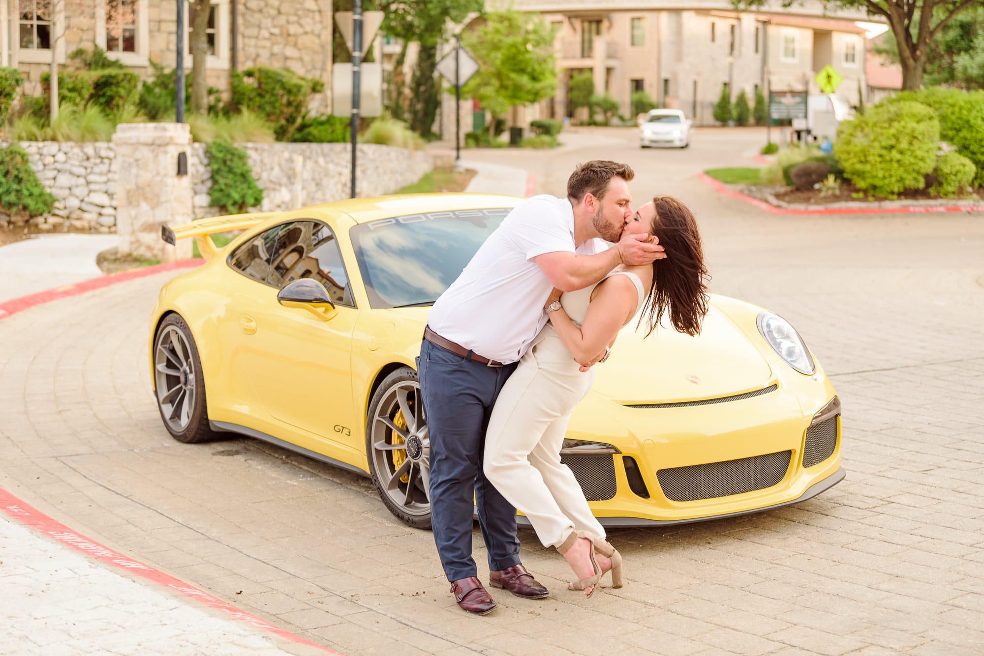 The yellow porche car in the background really makes these engagement photos have a European style.