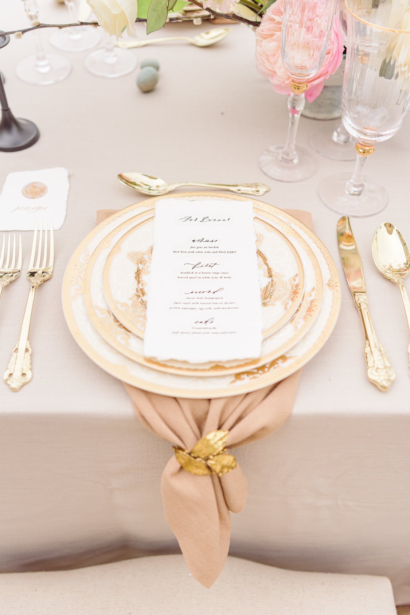 Idea for an outdoor wedding place setting with beige and gold.
