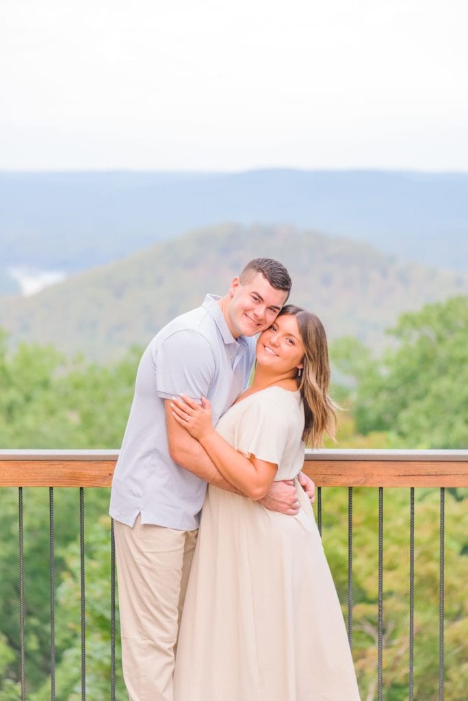 Hannah and Trent hug each other during their engagement photos at the mountain's scenic overlook.