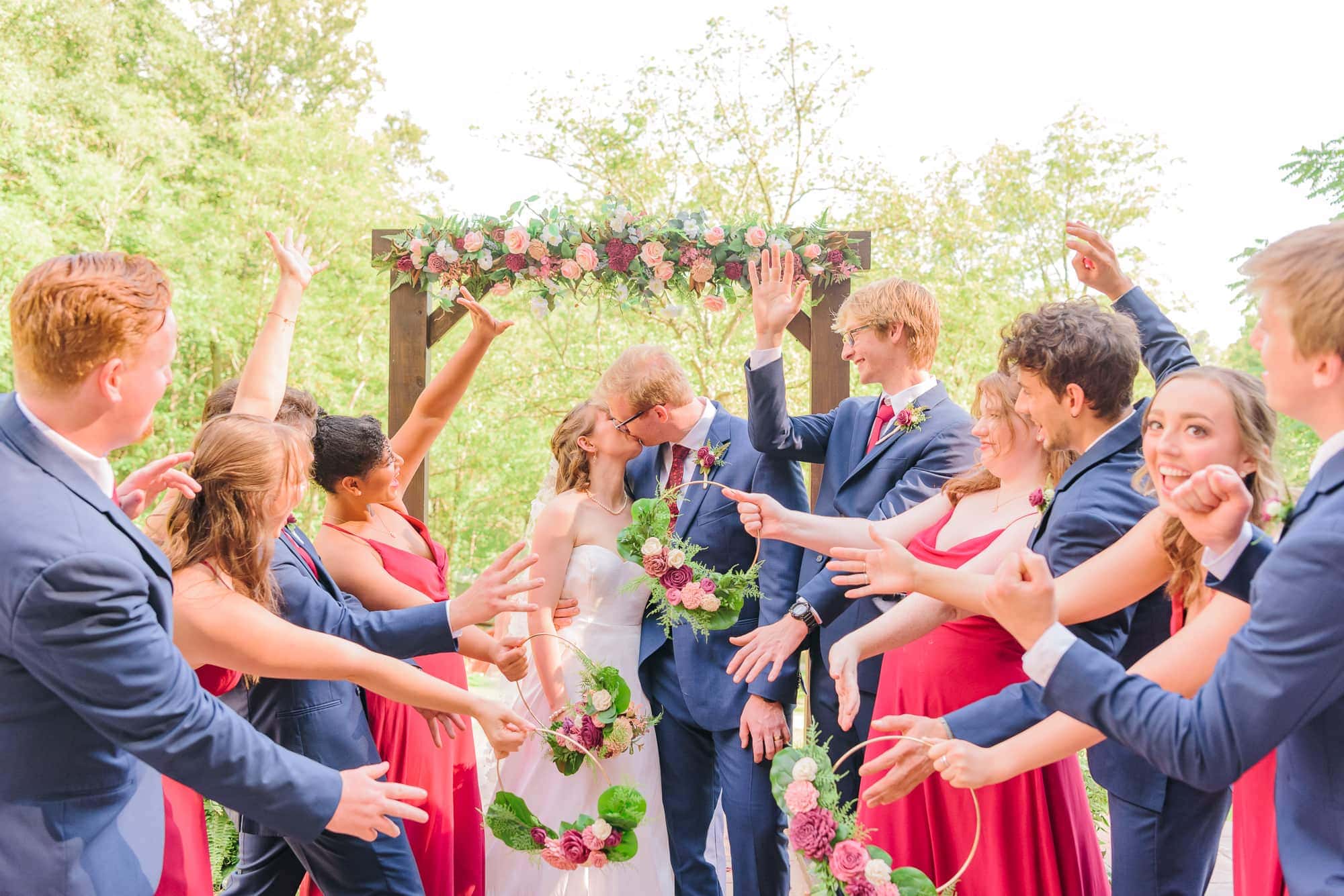 The whole bridal party cheers after Erin and Will get married at Delaney Ridge.