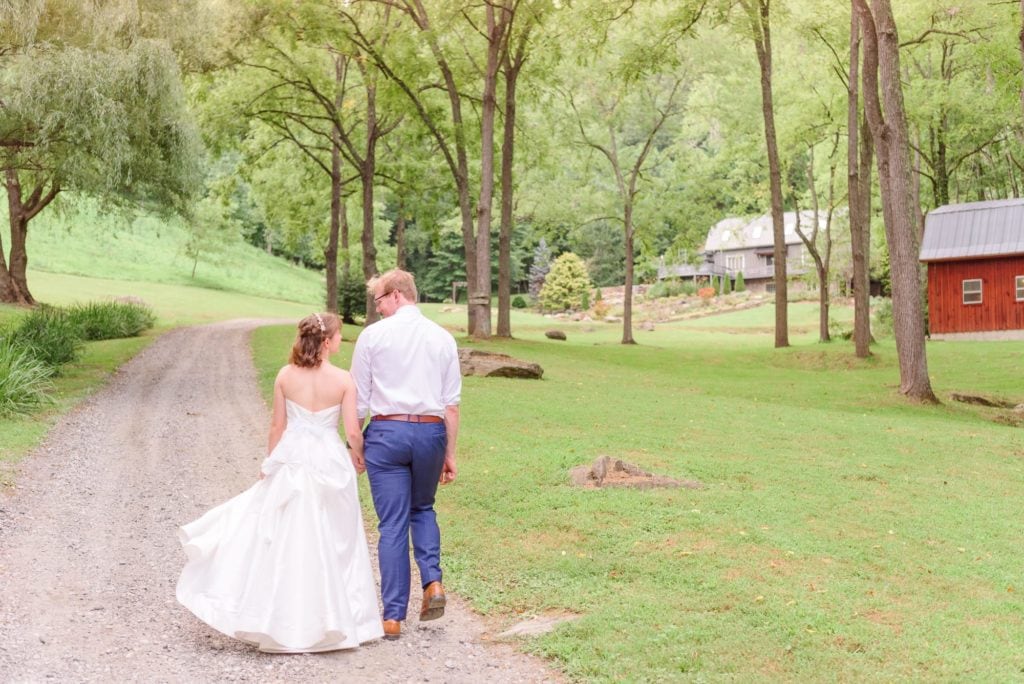 Erin and Will walk towards the ceremony site at Delaney Ridge in Ashville.