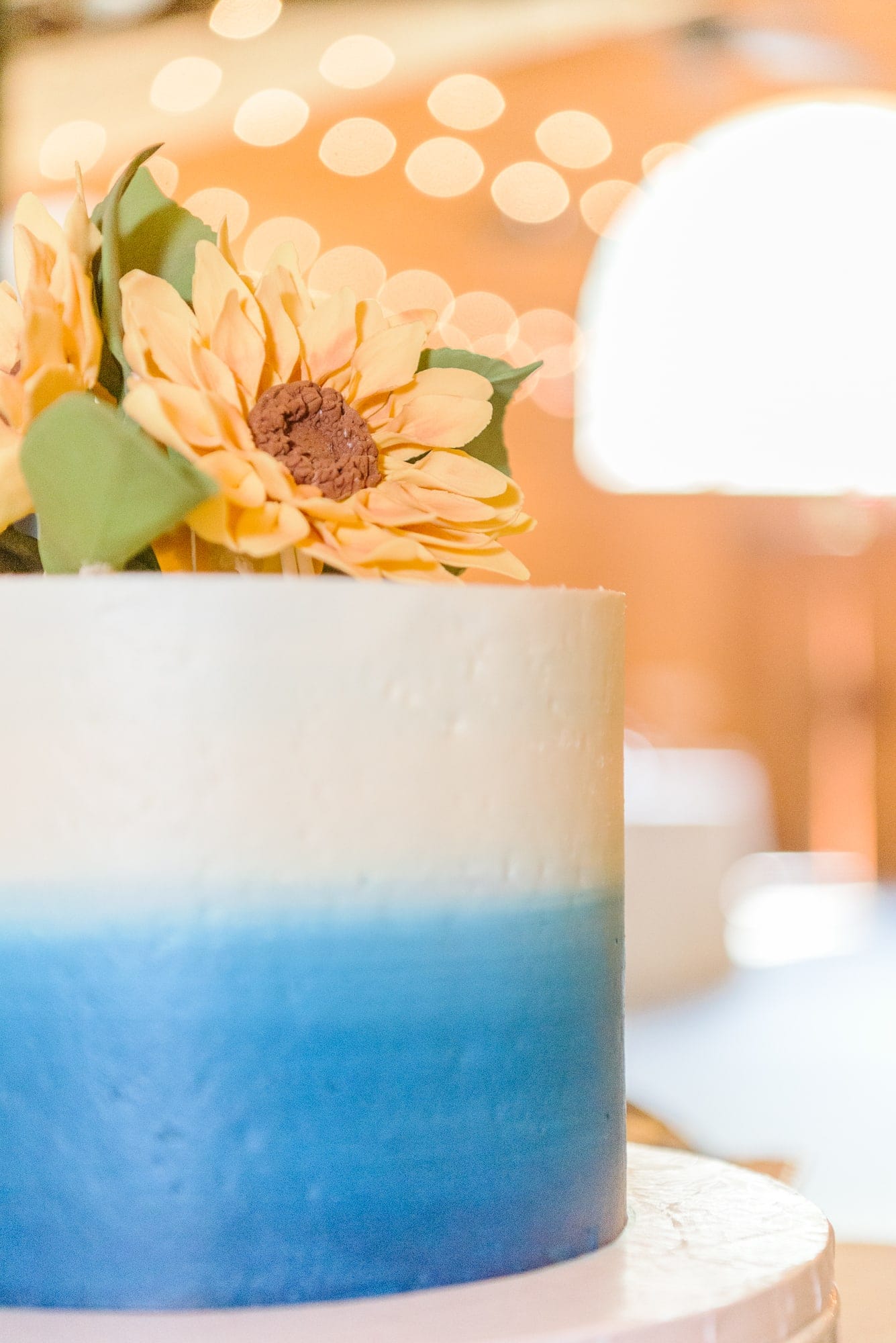 This simple blue and white ombre cake with sunflowers fit the Alexander Homestead aesthetic perfectly.