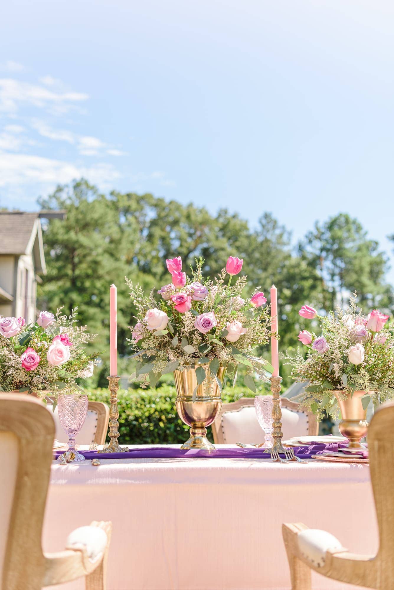 This Key Rose Estate session had pink and purple floral centerpieces placed inside large gold chalices. 