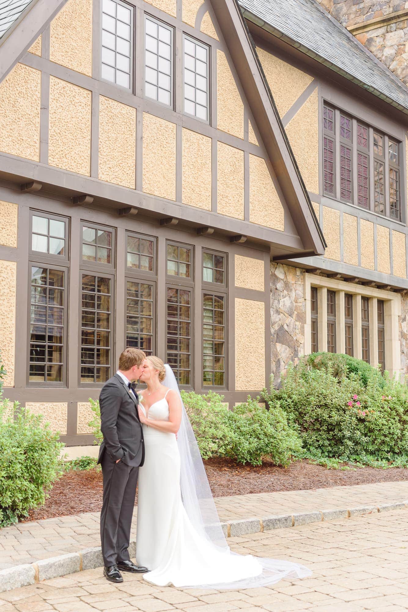 Lauren and Casey share a kiss outside the Longview Country Club in Charlotte.
