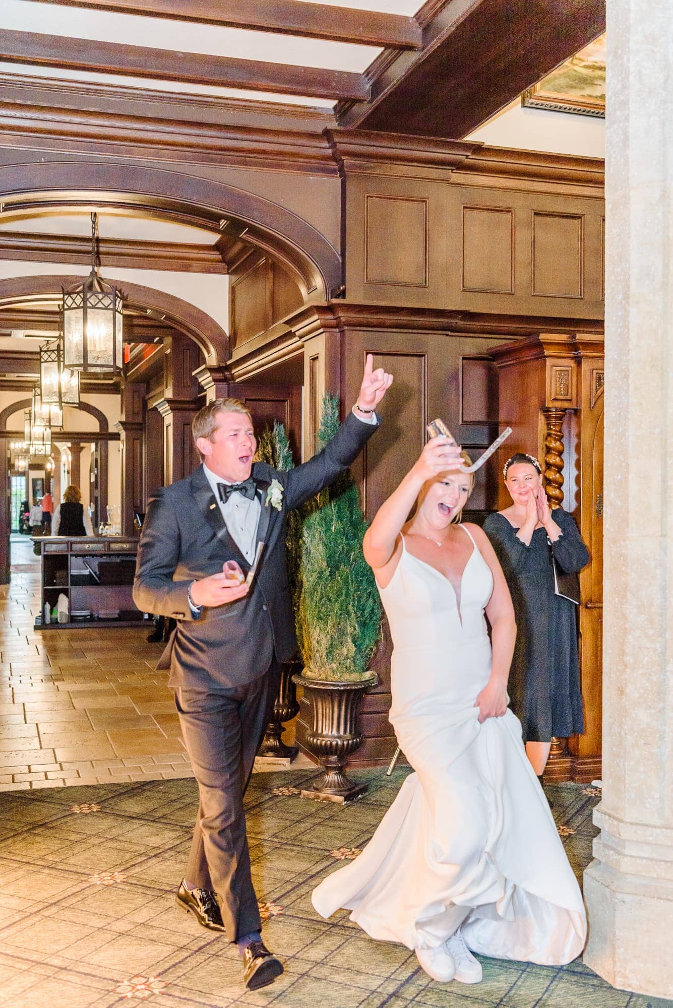 The bride and groom had a high energy entrance to their Charlotte reception at the Longview Country Club.