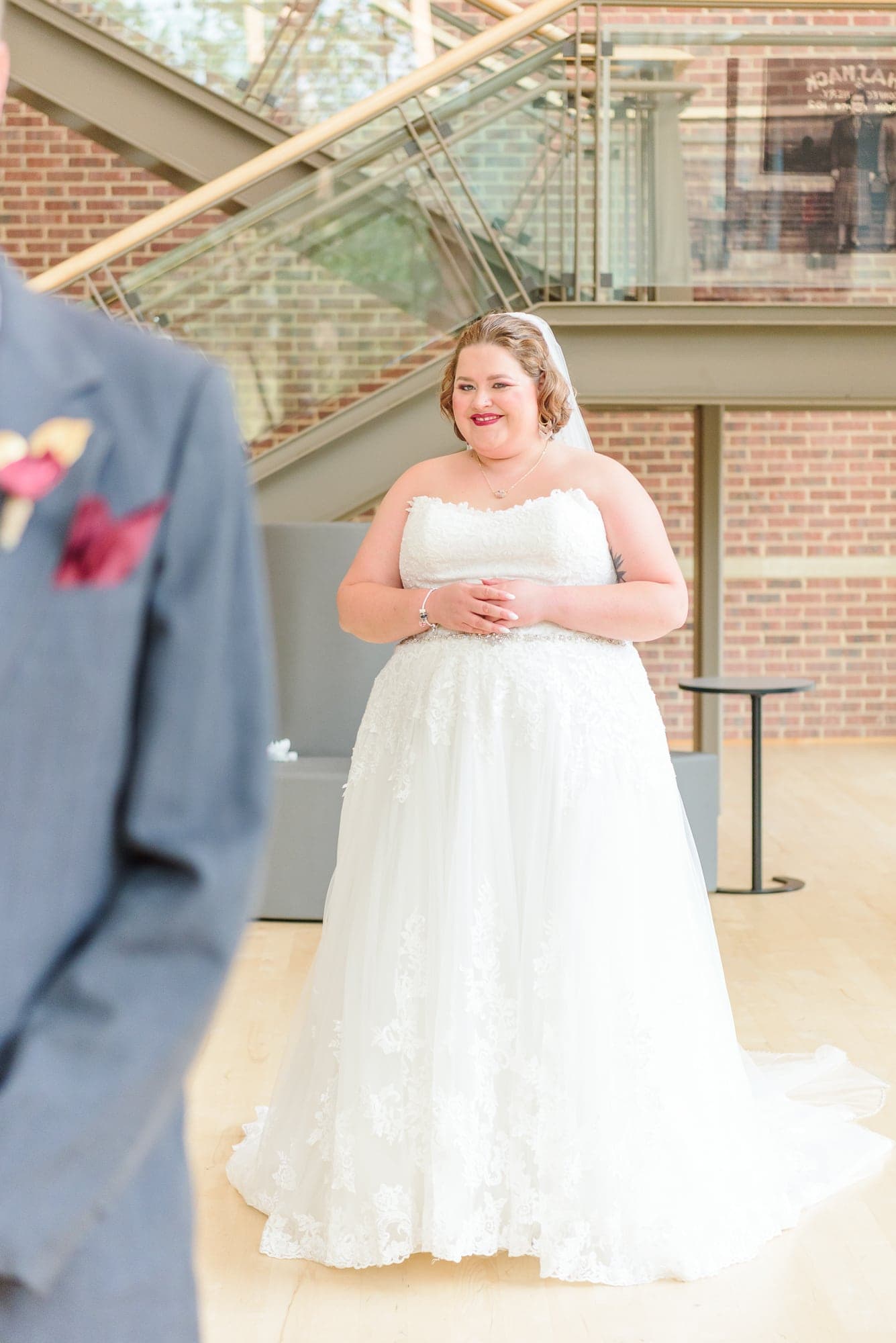 The bride stands behind her dad at the entrance to the Charles Mack Citizen Center in Mooresville.