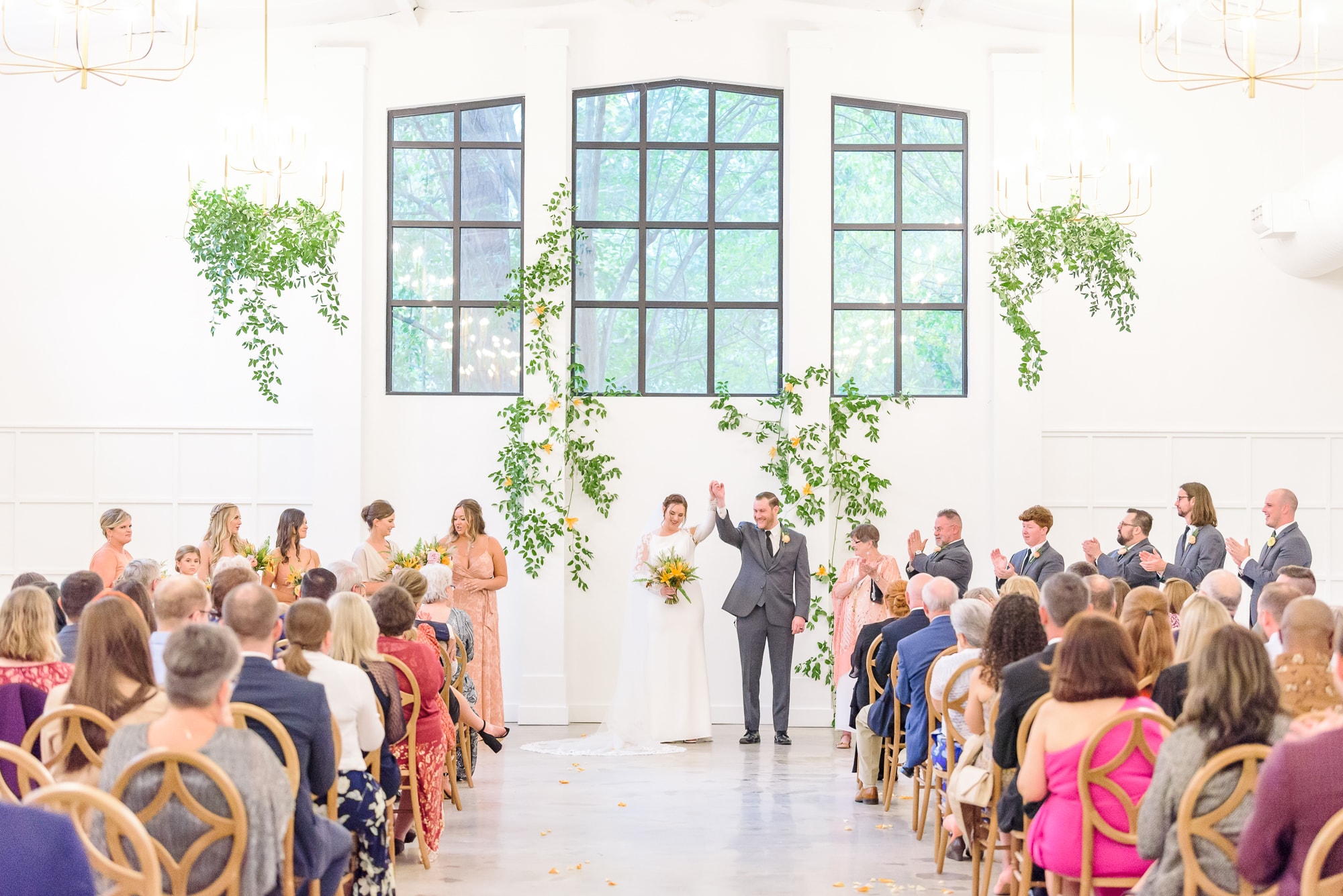 This Garner, NC wedding venue, the Distillery, is perfect for a bright, elegant ceremony like this one.