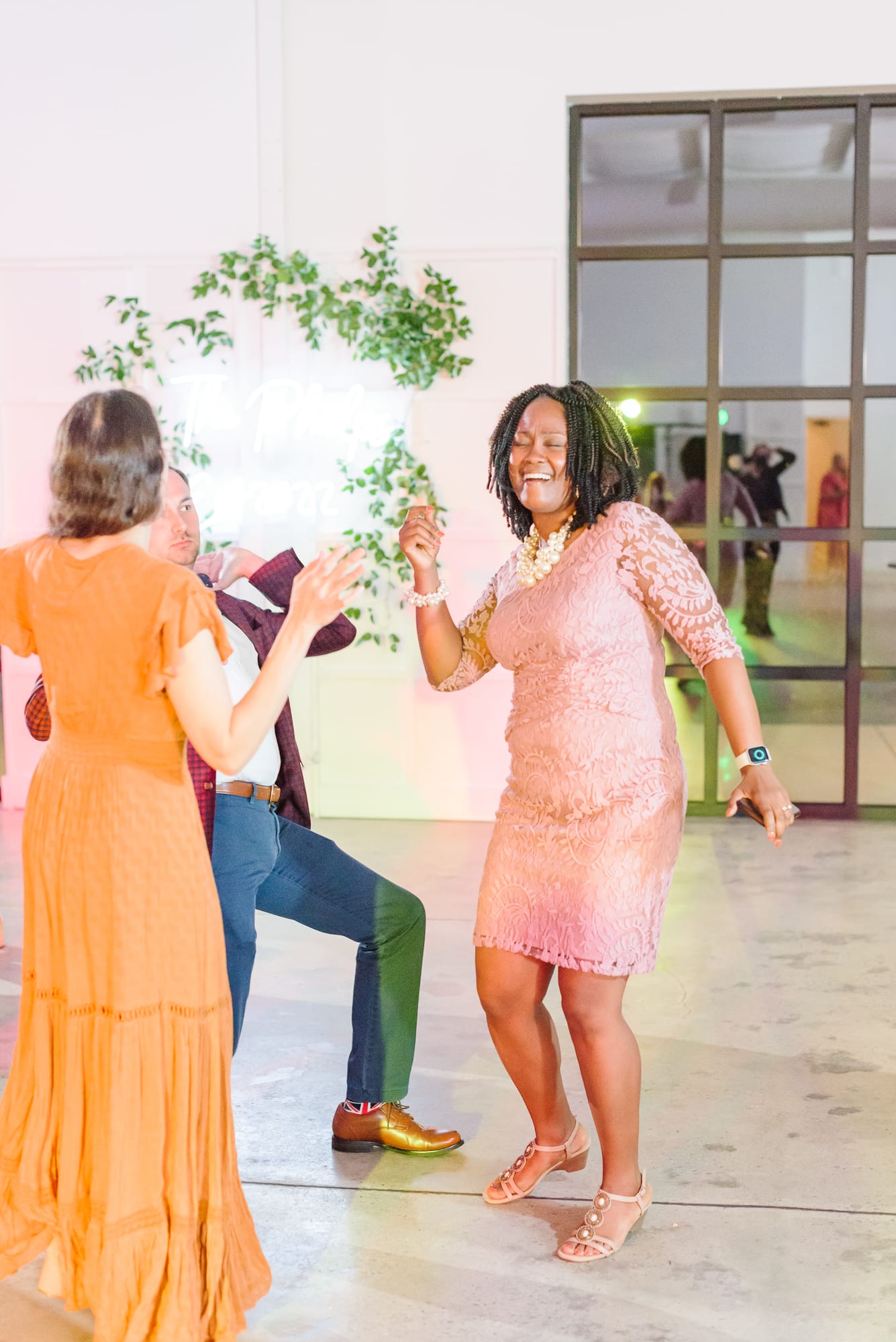 Guests have a great time on the dance floor at the Distillery after this lovely Garner wedding in NC.