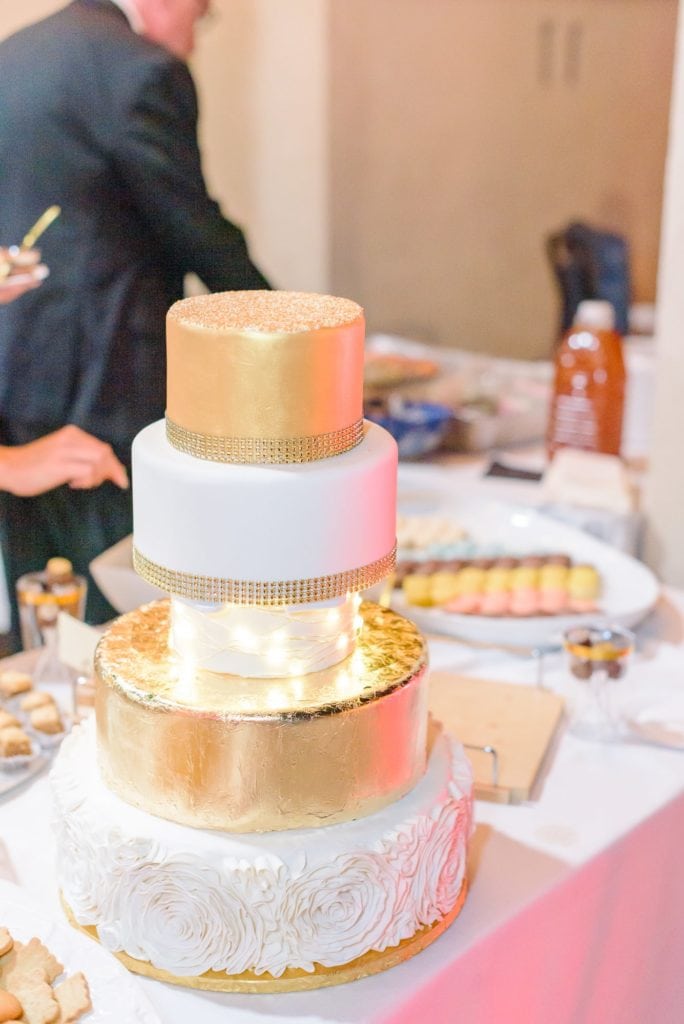 This Hollywood themed wedding cake has 5 layers, one of which is clear with lights inside.