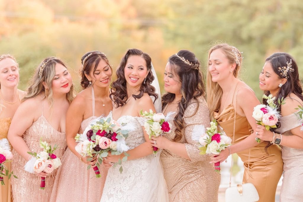 Ashley laughs with her bridesmaids after her Hollywood themed wedding ceremony.