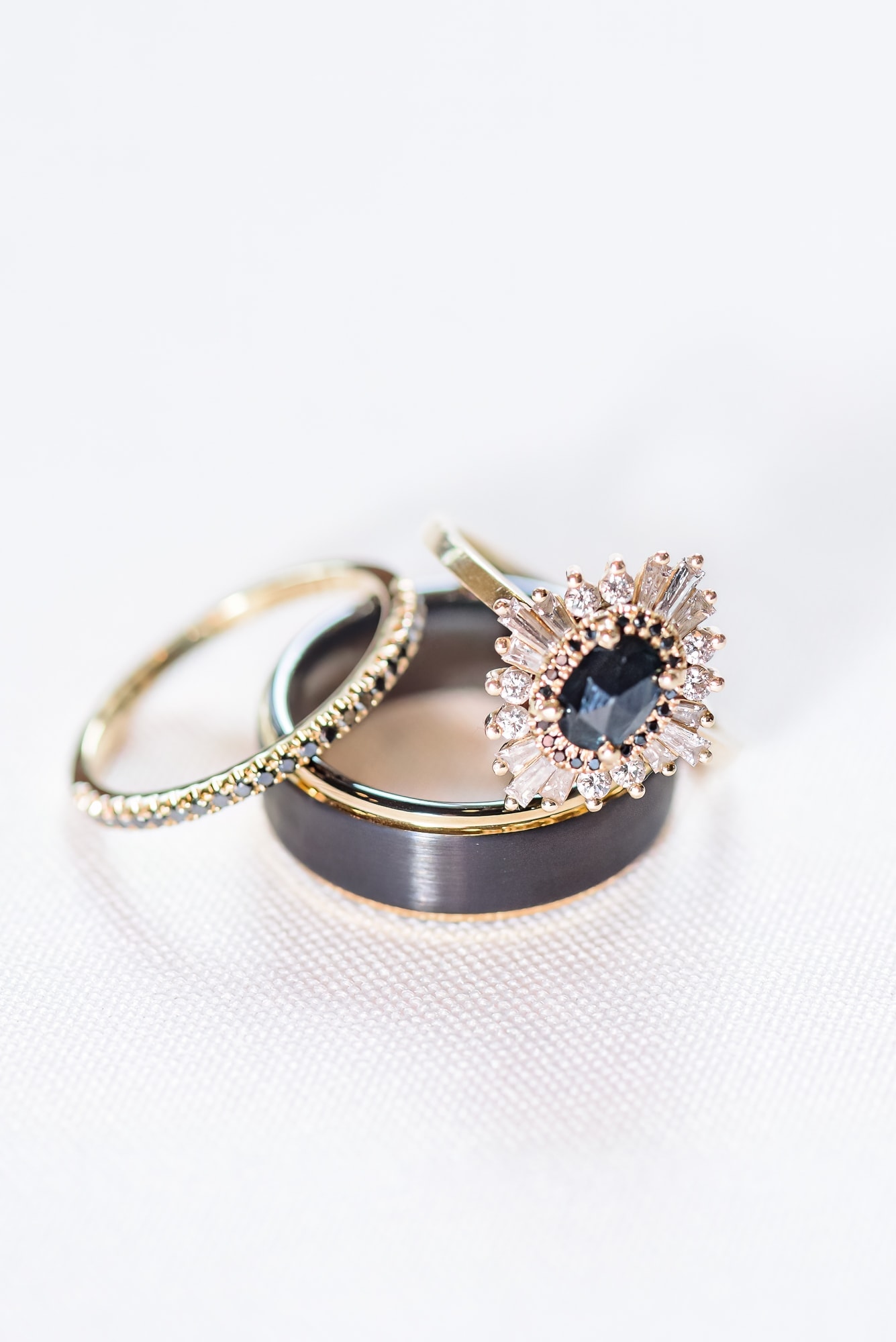 This Whitehead Manor wedding had a unique set of engagement rings, with a dark black stone in the middle of a gold setting.