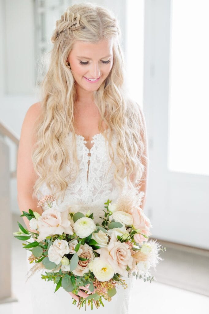 This beach wedding in North Carolina had white and pale pink roses in the bride's bouquet.