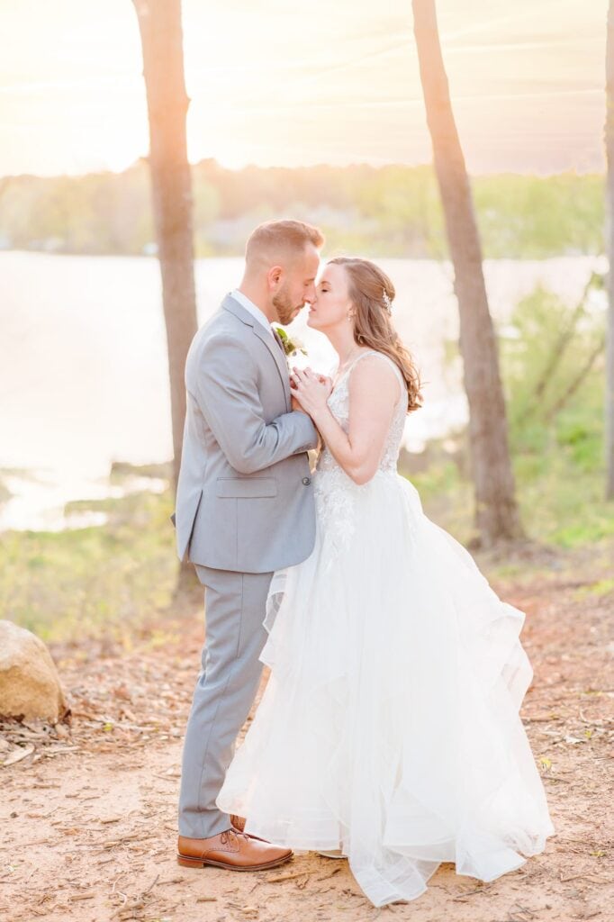 An outdoor wedding in North Carolina with gorgeous sunset photos on the lake.