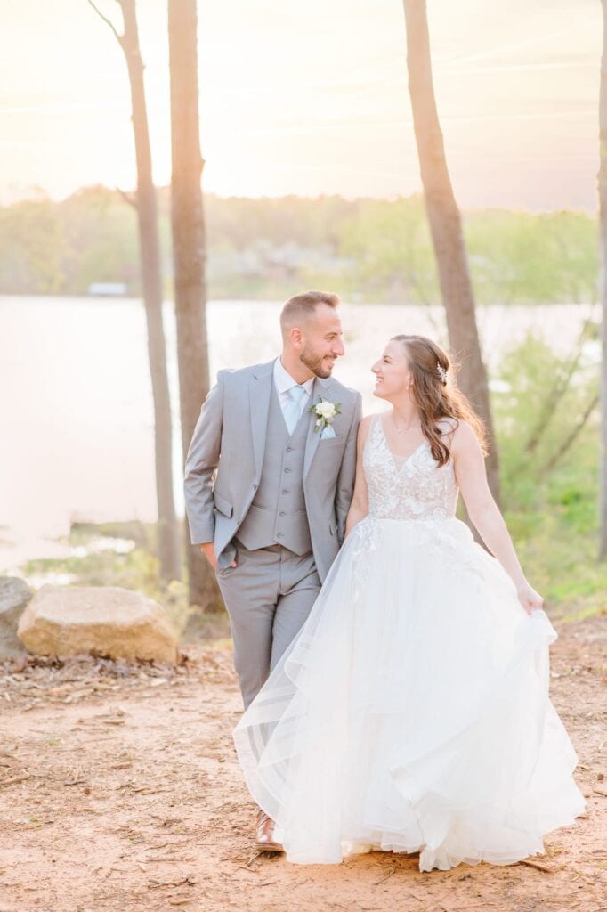 This outdoor wedding in North Carolina had a beautiful lake where the couple walked hand in hand.