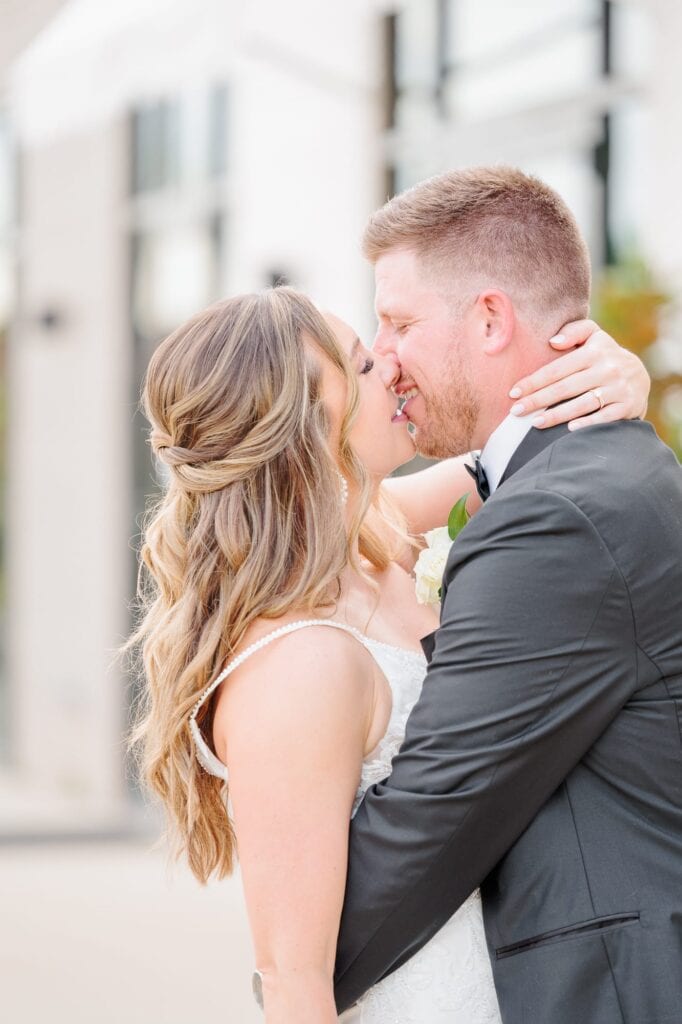 This wedding at the Ruth in Charlotte, NC had the happiest couple going in for a kiss.