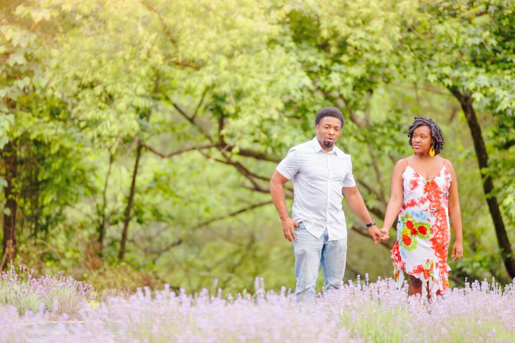 LaVianca and Shakim walk through the lavender farm in NC together.