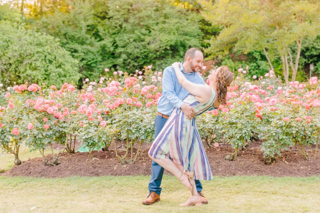 At the Raleigh rose garden in North Carolina, Emelia and Wakefield dance in front of a garden bed of pink roses.
