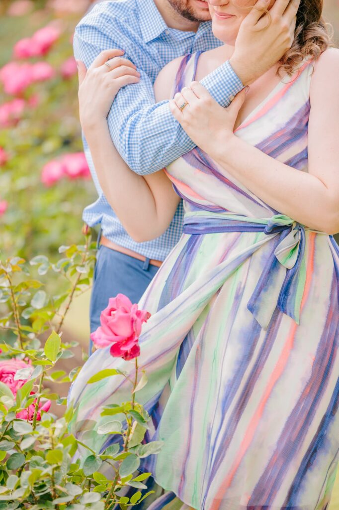 A closeup of Emelia's pastel tie dye dress flowing in the wind at the Raleigh NC rose garden.