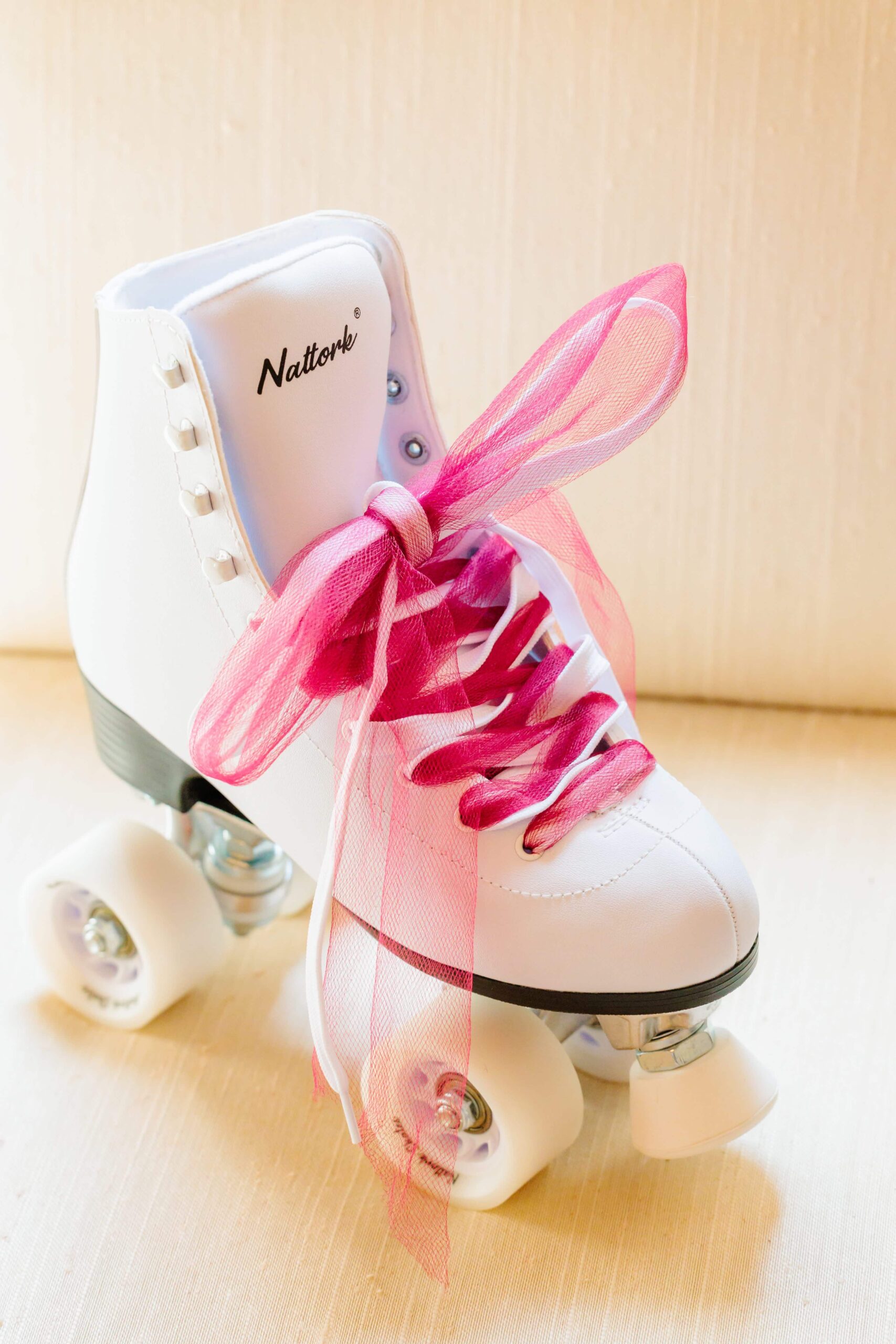 Roller skates with bright pink laces were the perfect compliment to this disco themed wedding.
