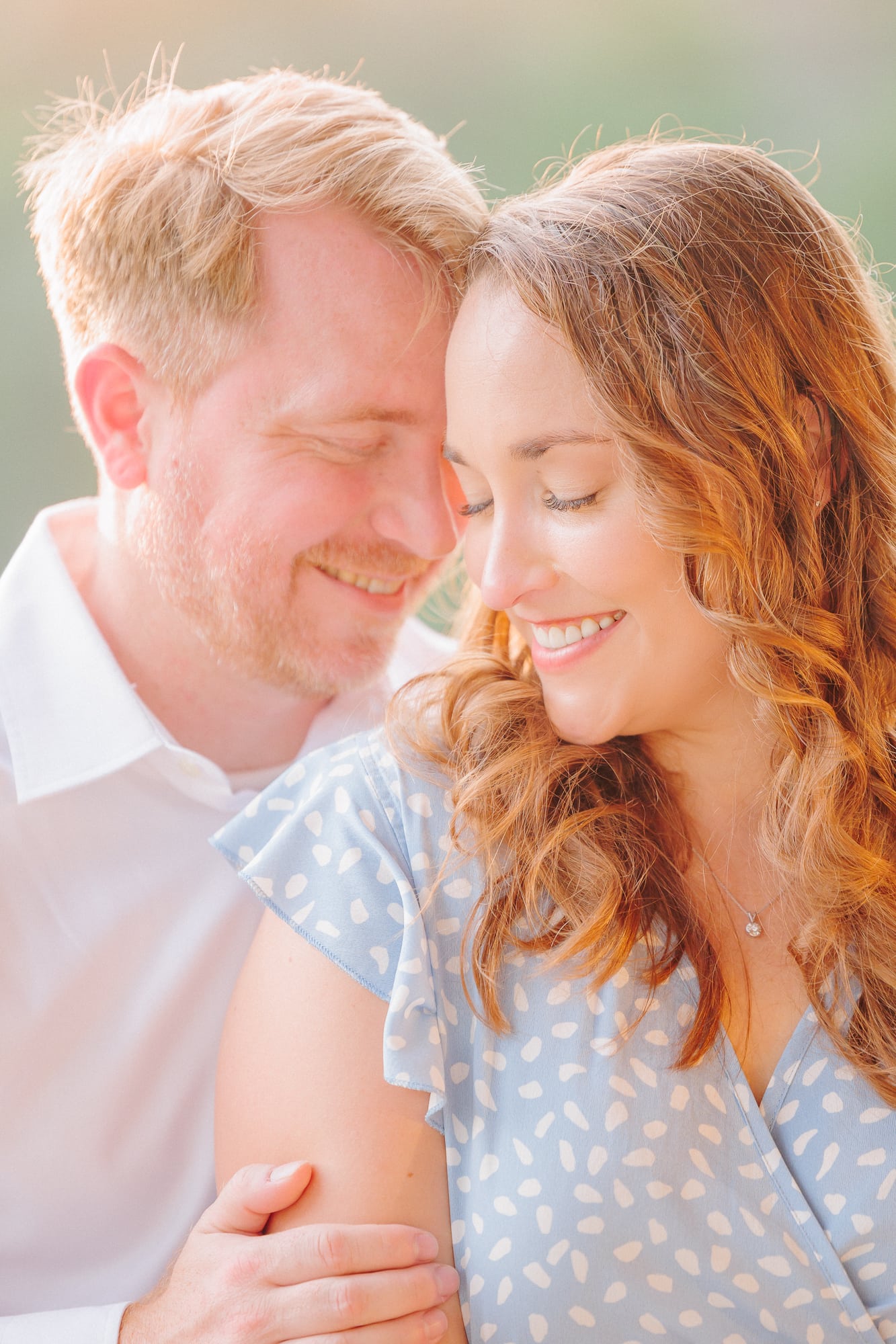 The couple's laughter fills the air at North Corner Haven during their engagement shoot.