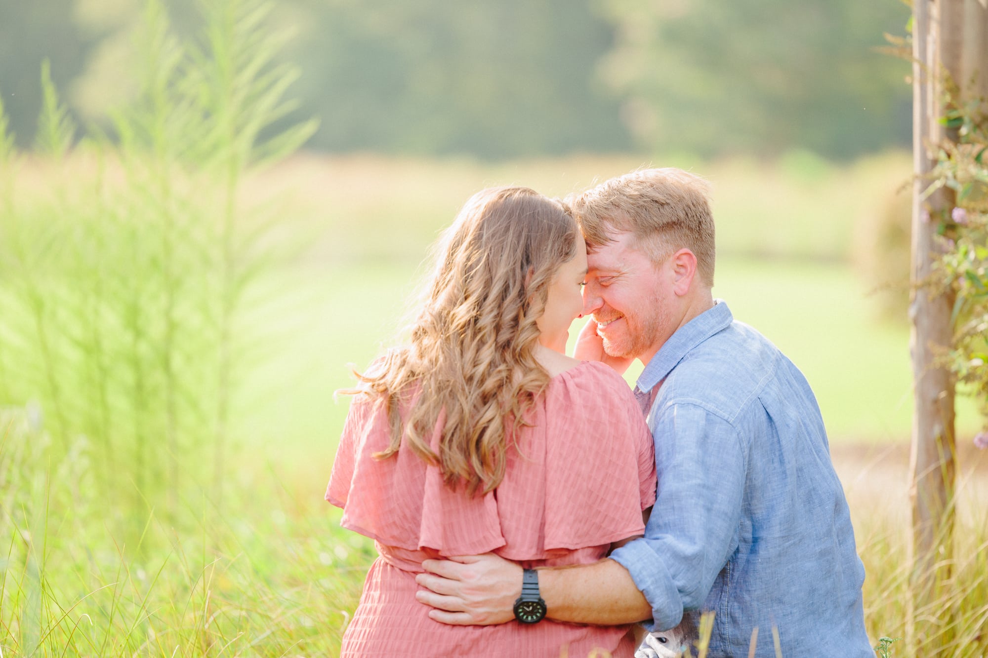 A loving couple embraces amid the lush greenery at North Corner Haven.