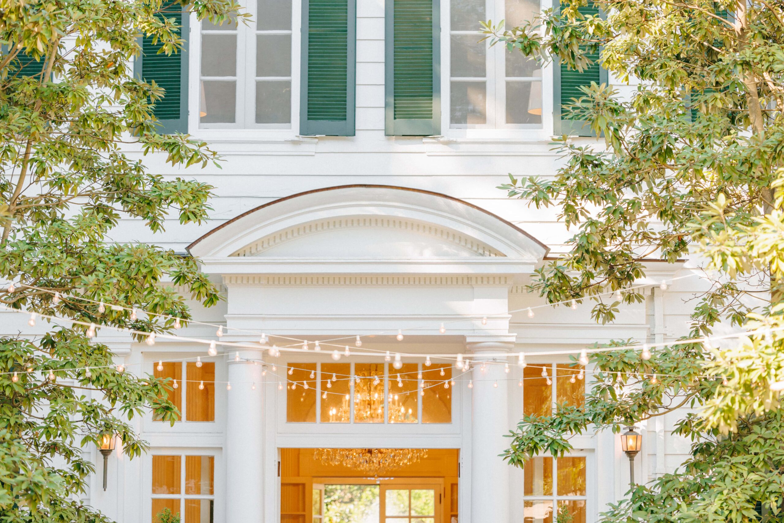 String lights hung in preparation for a wedding at Duke Mansion.